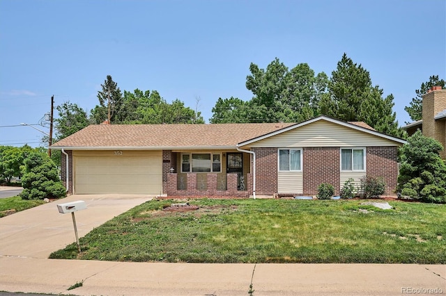 352 S Peoria Cir, Aurora, CO 80012 - ranch-style home featuring brick siding, an attached garage, concrete driveway, and a front yard