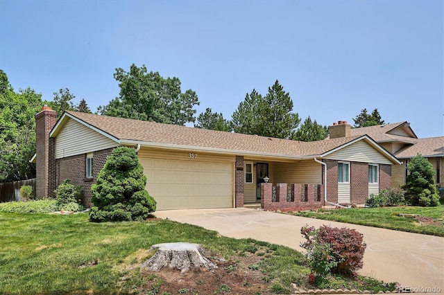 352 S Peoria Cir, Aurora, CO 80012 - ranch-style house featuring brick siding, an attached garage, driveway, a chimney, and a front lawn