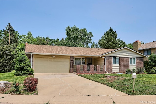 352 S Peoria Cir, Aurora, CO 80012 - ranch-style home featuring brick siding, an attached garage, driveway, and a front yard
