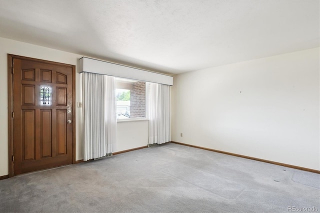 352 S Peoria Cir, Aurora, CO 80012 - foyer featuring healthy amount of natural light and light carpet