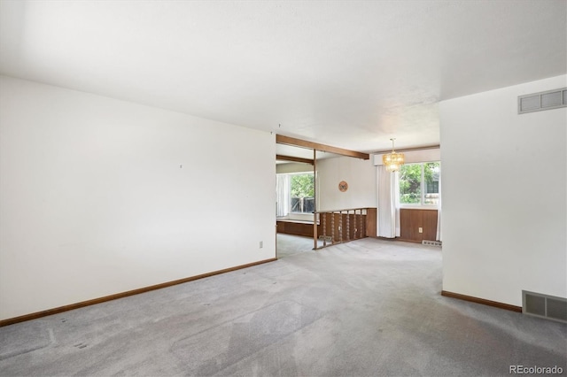 352 S Peoria Cir, Aurora, CO 80012 - carpeted spare room featuring a chandelier and baseboards