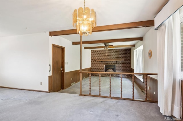 352 S Peoria Cir, Aurora, CO 80012 - unfurnished living room featuring ceiling fan, carpet, beam ceiling, wainscoting, and a fireplace