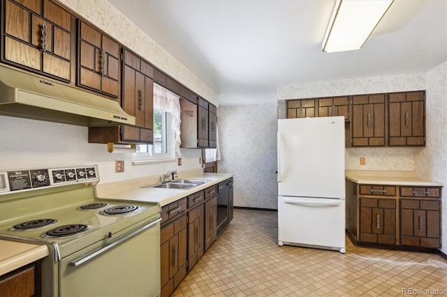 352 S Peoria Cir, Aurora, CO 80012 - kitchen featuring white appliances, wallpapered walls, light countertops, under cabinet range hood, and dark brown cabinets