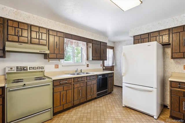 352 S Peoria Cir, Aurora, CO 80012 - kitchen with white appliances, under cabinet range hood, wallpapered walls, and light countertops