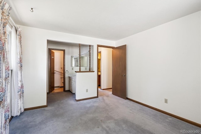 352 S Peoria Cir, Aurora, CO 80012 - unfurnished bedroom featuring baseboards and light carpet