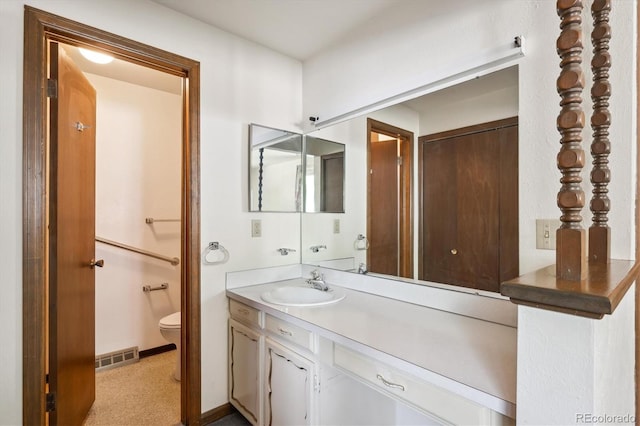 352 S Peoria Cir, Aurora, CO 80012 - bathroom featuring vanity and toilet