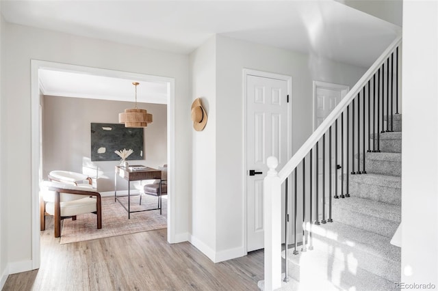 staircase featuring hardwood / wood-style floors