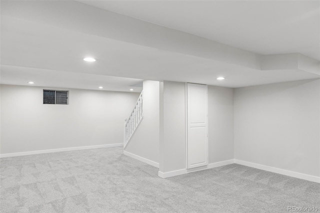 basement with light colored carpet