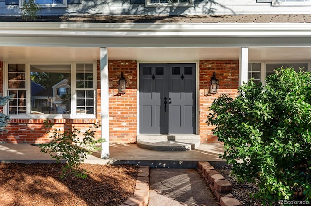 property entrance featuring covered porch