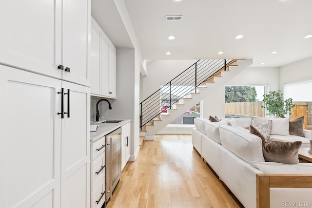 2040 W 45th Ave, Denver, CO 80211 - living room with stairs, light wood-style floors, and recessed lighting