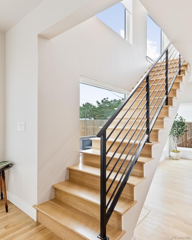 2040 W 45th Ave, Denver, CO 80211 - staircase with wood finished floors and baseboards