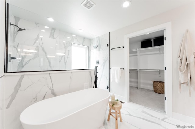 2040 W 45th Ave, Denver, CO 80211 - bathroom with a walk in closet, a marble finish shower, a soaking tub, recessed lighting, and marble finish floors