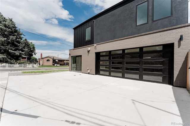 2040 W 45th Ave, Denver, CO 80211 - view of home's exterior with brick siding, concrete driveway, and stucco siding