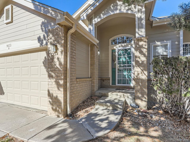 property entrance with a garage