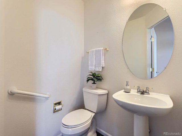 bathroom featuring toilet