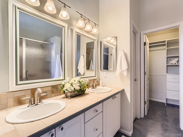 bathroom with vanity and walk in shower