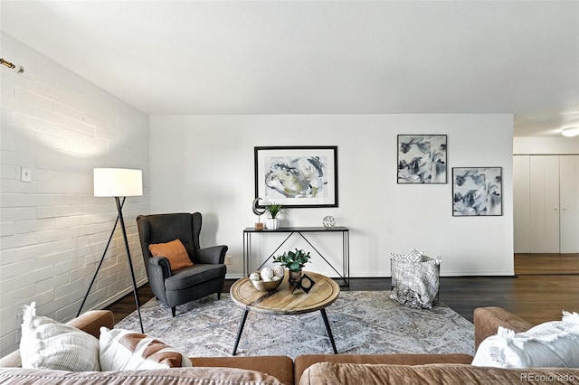 460 S Marion Pkwy Unit 801, Denver, CO 80209 - living area featuring wood finished floors and brick wall