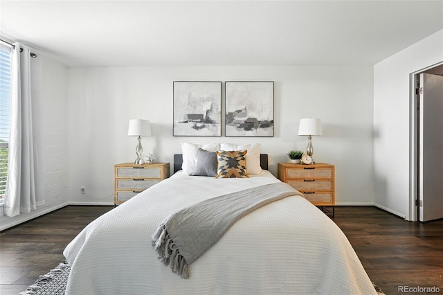 460 S Marion Pkwy Unit 801, Denver, CO 80209 - bedroom featuring wood finished floors and multiple windows
