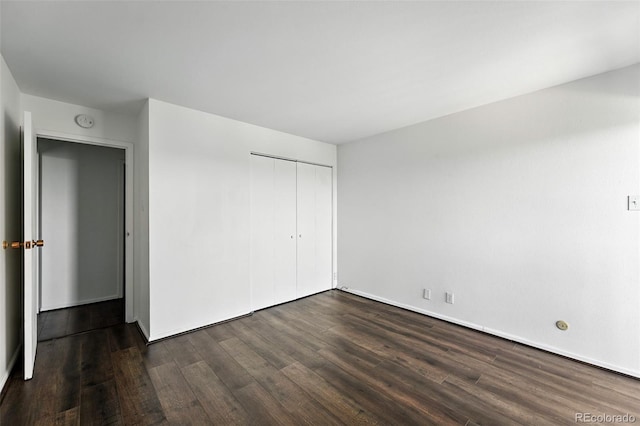 460 S Marion Pkwy Unit 801, Denver, CO 80209 - unfurnished bedroom with dark wood finished floors and a closet