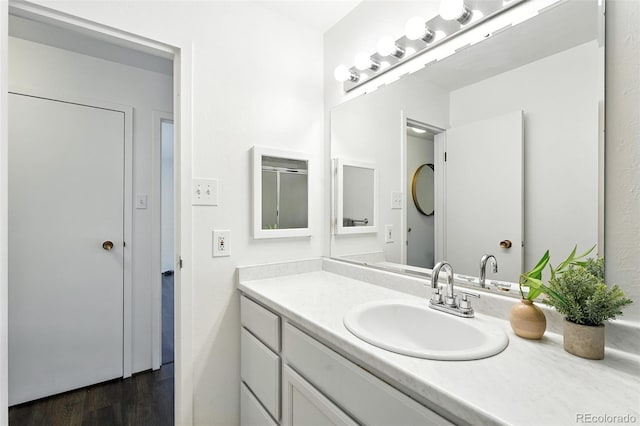 460 S Marion Pkwy Unit 801, Denver, CO 80209 - bathroom featuring vanity and wood finished floors