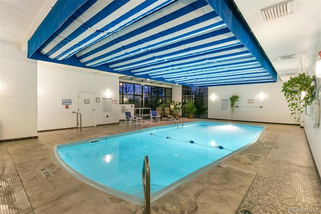 460 S Marion Pkwy Unit 801, Denver, CO 80209 - indoor community pool featuring a patio area