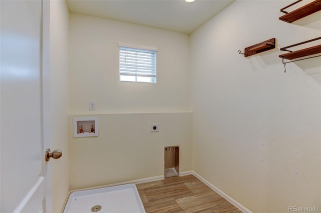 washroom featuring hookup for a washing machine, light wood-style flooring, hookup for an electric dryer, laundry area, and baseboards