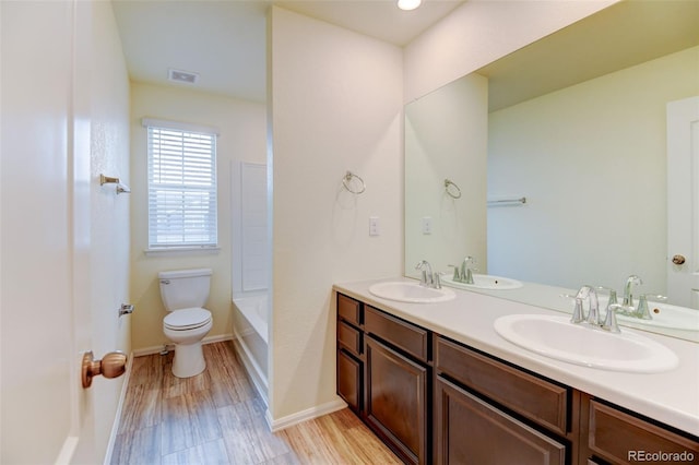 full bath featuring toilet and a sink