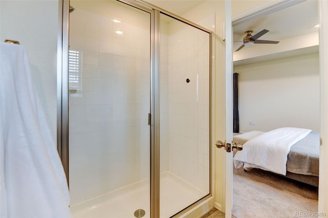 ensuite bathroom featuring ensuite bath, ceiling fan, and a shower stall