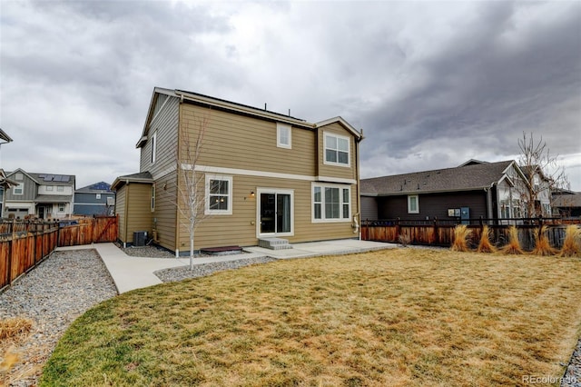 rear view of property featuring central AC, a patio, a lawn, and fence