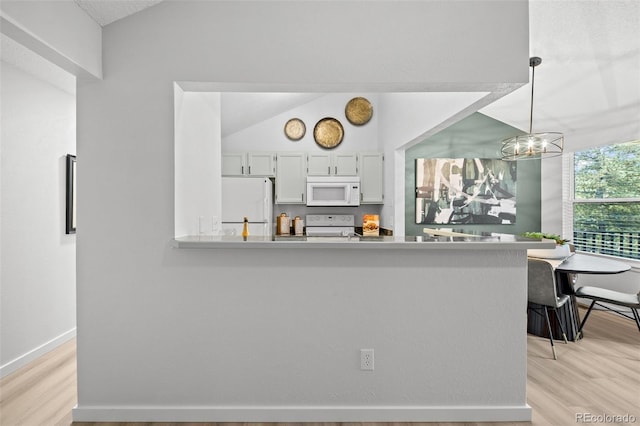 6755 S Field St Unit 625, Littleton, CO 80128 - kitchen with white appliances, light wood-style floors, a peninsula, a chandelier, and light countertops