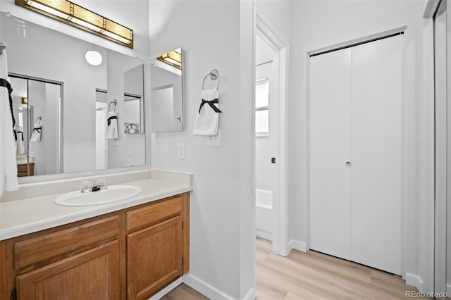 6755 S Field St Unit 625, Littleton, CO 80128 - full bath with wood finished floors, vanity, and baseboards
