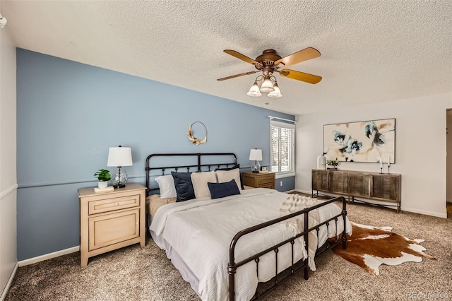 bedroom with carpet, ceiling fan, a textured ceiling, and baseboards