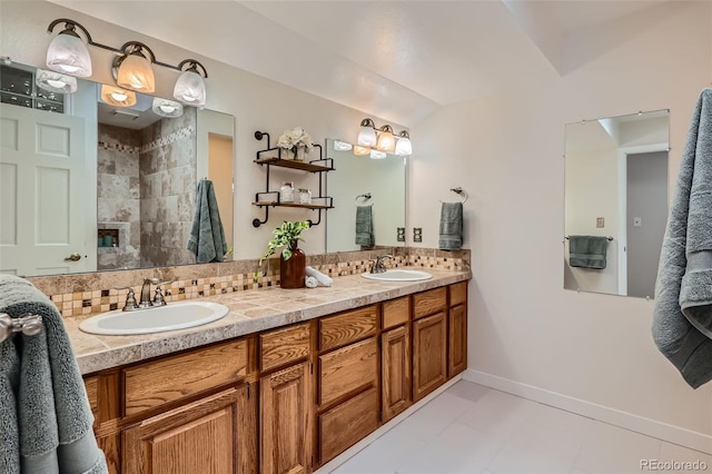 bathroom featuring a sink, decorative backsplash, and double vanity