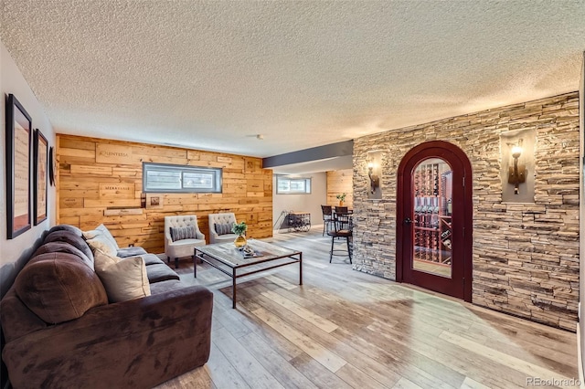 living room featuring light wood-style floors and a textured ceiling