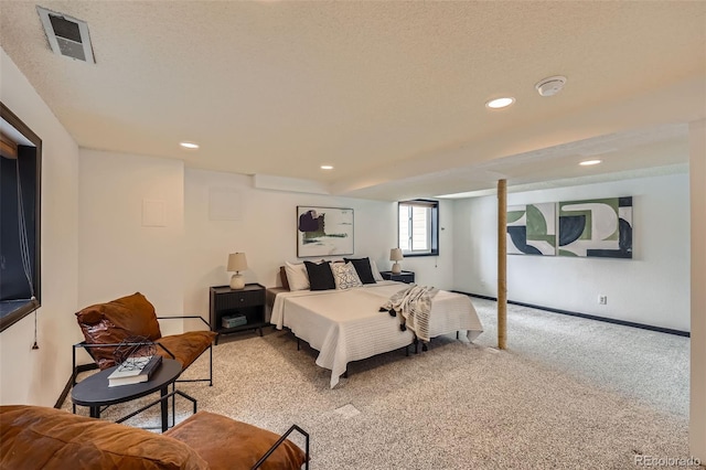 bedroom featuring a textured ceiling, recessed lighting, light carpet, visible vents, and baseboards