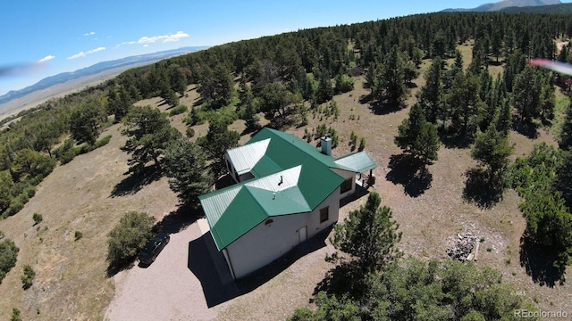 4860 County Road 140, Westcliffe, CO 81252 - aerial view of property's location with a forest and a mountainous background