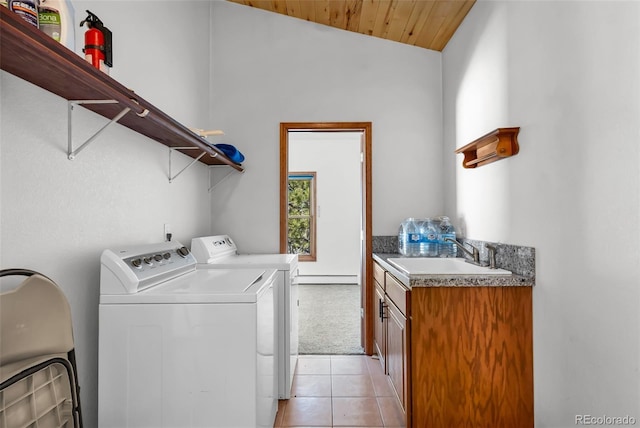 4860 County Road 140, Westcliffe, CO 81252 - laundry area with washing machine and clothes dryer, a baseboard heating unit, cabinet space, light tile patterned flooring, and wooden ceiling
