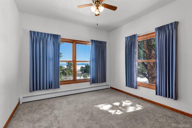 4860 County Road 140, Westcliffe, CO 81252 - spare room with a baseboard heating unit, carpet, baseboards, and a ceiling fan