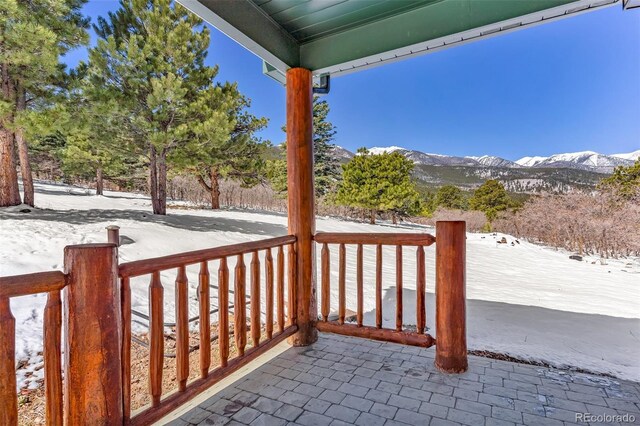 4860 County Road 140, Westcliffe, CO 81252 - snow covered patio featuring covered porch and a mountain view
