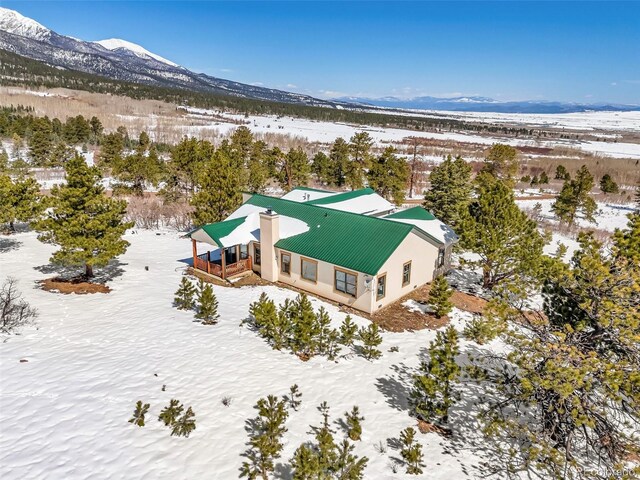 4860 County Road 140, Westcliffe, CO 81252 - snowy aerial view featuring a mountain view