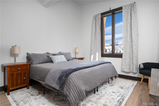 bedroom with light hardwood / wood-style flooring