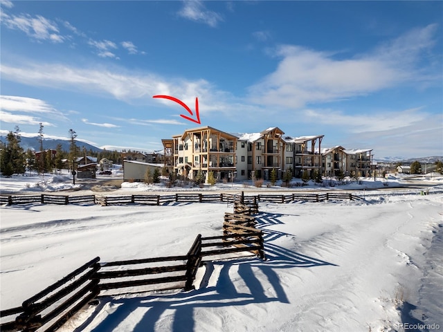 16 Springview Ln Unit A 304, Fraser, CO 80442 - snowy yard with fence and a mountain view