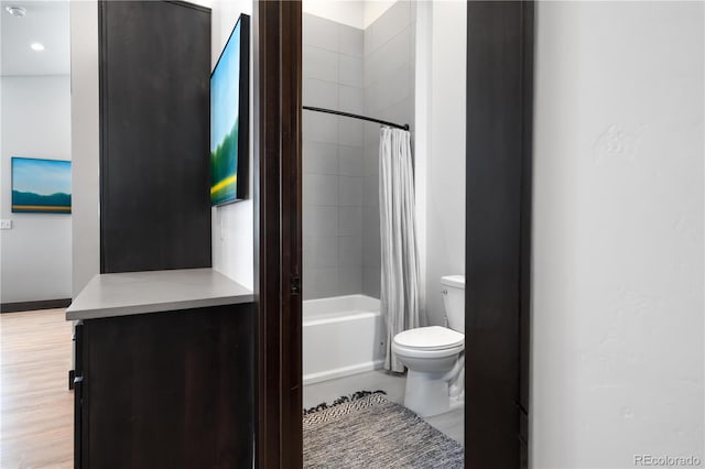 16 Springview Ln Unit A 304, Fraser, CO 80442 - bathroom with toilet, shower / bathtub combination with curtain, baseboards, and wood finished floors