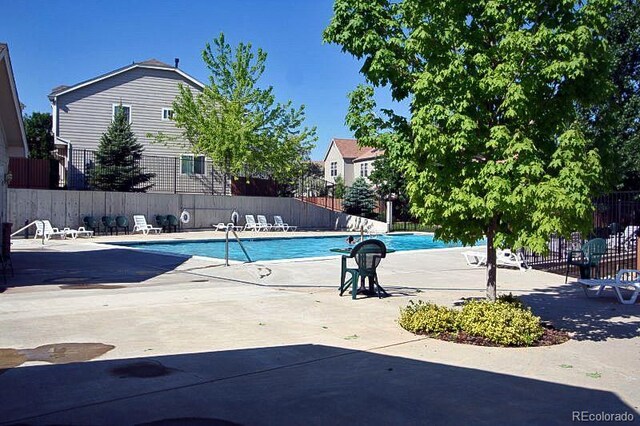 1128 S Ventura Cir Unit K, Aurora, CO 80017 - community pool featuring a patio