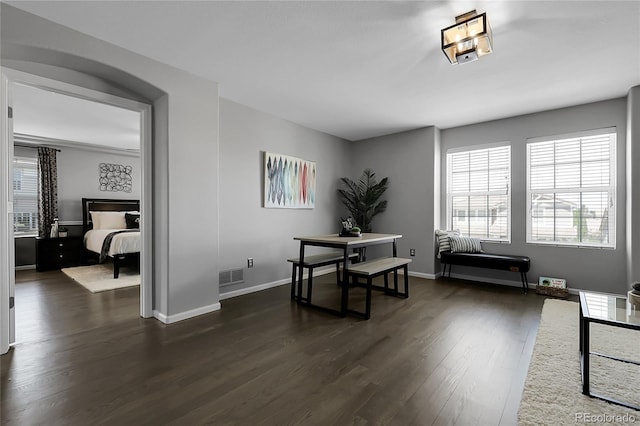 office space featuring dark wood-style floors and baseboards