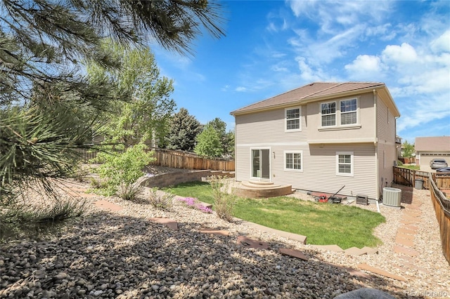 rear view of property with cooling unit