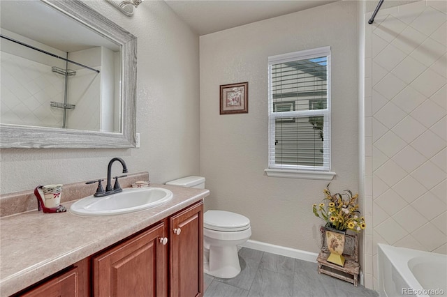full bath with toilet, vanity, and baseboards