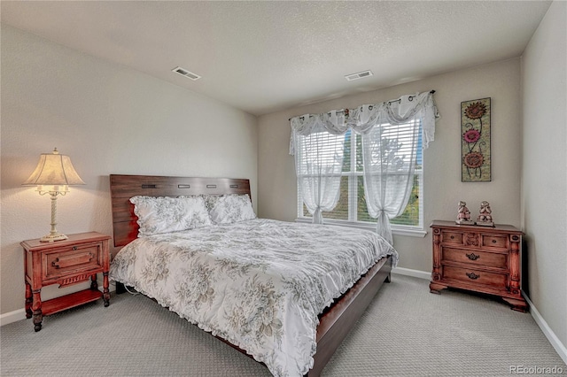 bedroom with carpet flooring and baseboards