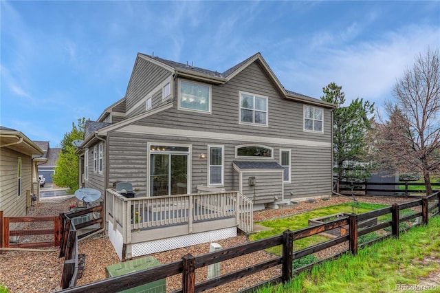 view of front of property with a wooden deck and fence