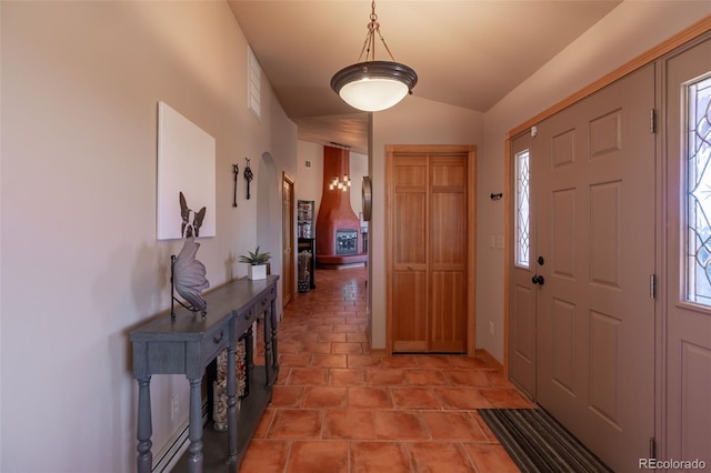 entrance foyer with vaulted ceiling